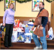 Susan & Kevin McKenzie supervise white gift presentation